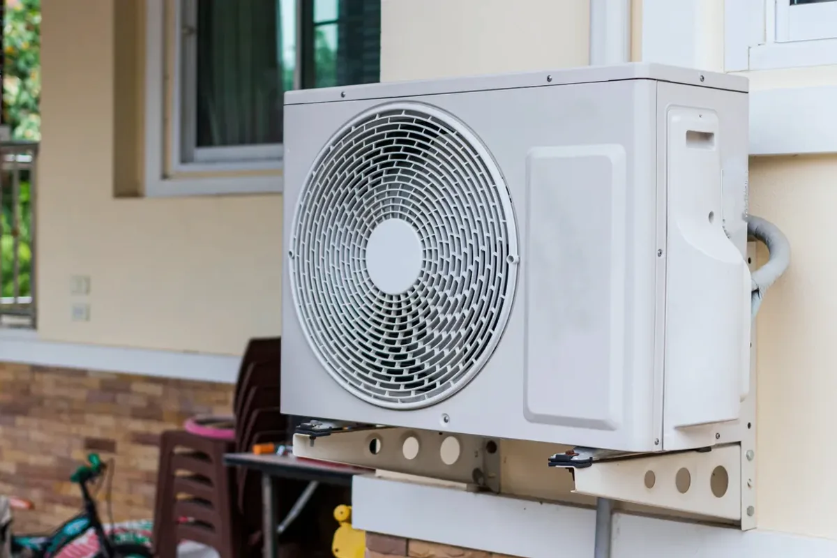 Outdoor heat pump unit on a wall bracket
